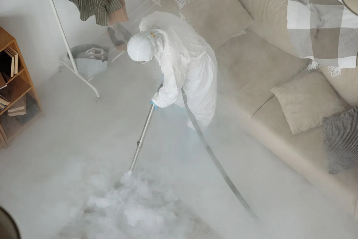 Biohazard cleanup technician in protective equipment, La Vernia, TX